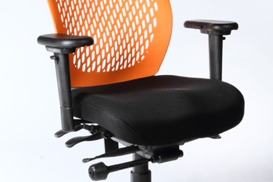 Armrest on an orange-backed Airopedic chair