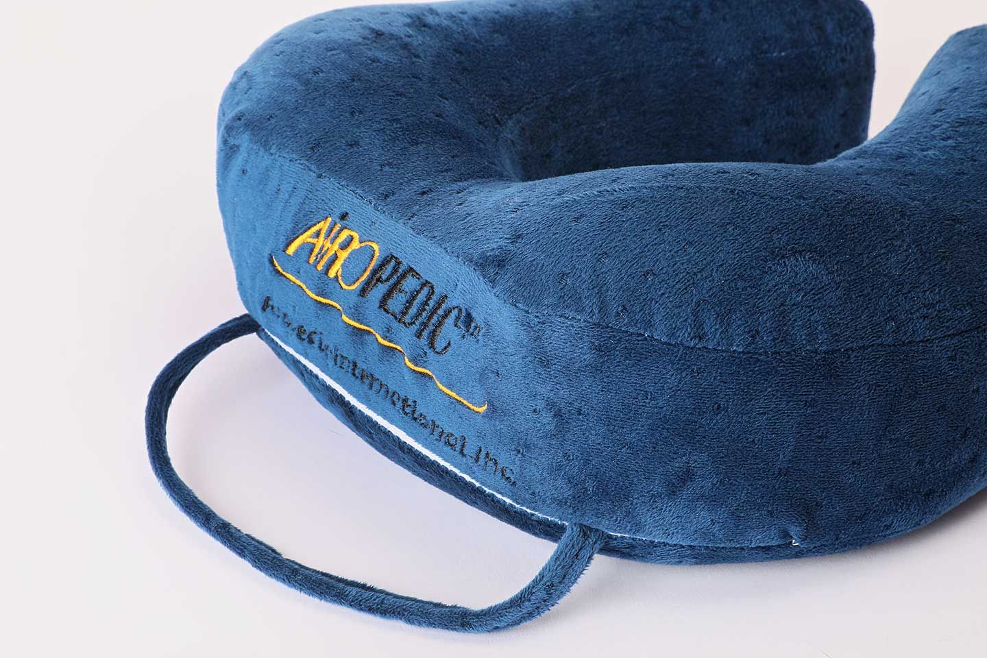 Airopedic memory foam travel neck pillow in blue plush velour
